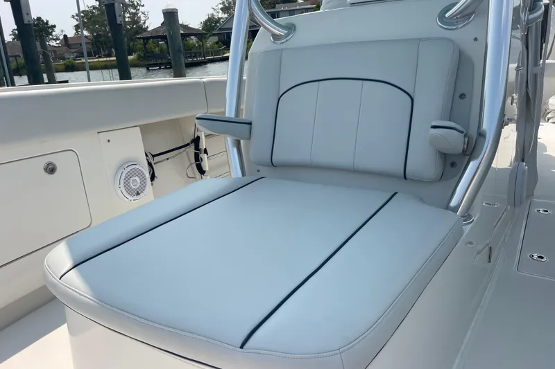 Slide: The Image of 2020 Jupiter 38 boat seat with sleek white upholstery and armrests. - 83