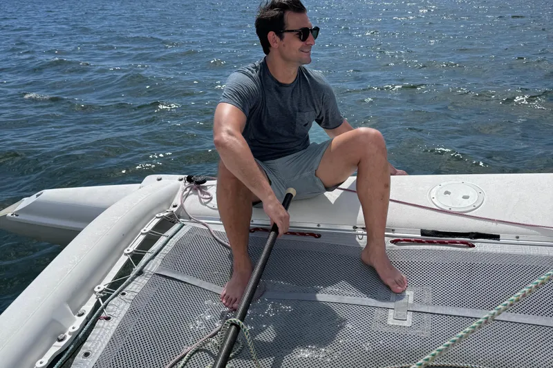 Slide: The Image of Man enjoying sailing on 2006 Corsair Sprint 750 trimaran in sunny weather. - 6