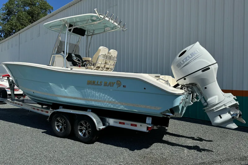 Slide: The Image of 2024 Bulls Bay 255 boat on trailer with Suzuki outboard motor. - 3