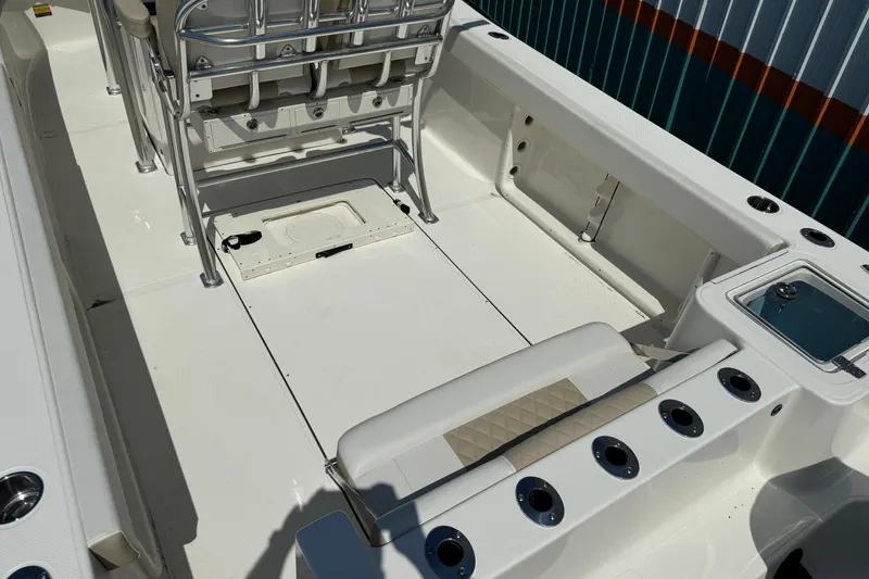 Slide: The Image of 2024 Bulls Bay 255 boat interior with seating and rod holders. - 7