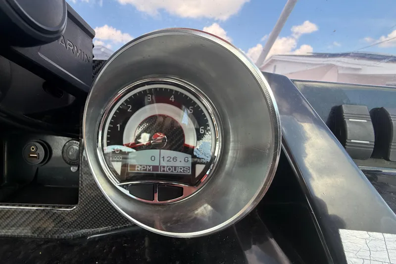 Slide: The Image of Close-up of 2019 Glastron GTD 220 boat tachometer displaying RPM and engine hours. - 32