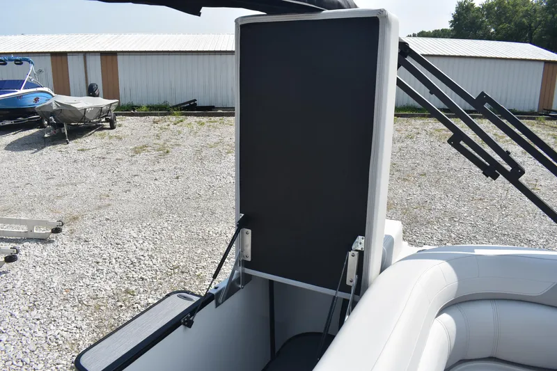 Slide: The Image of 2026 Godfrey SWEETWATER SW 2086 C boat interior with seating and storage compartment. - 16