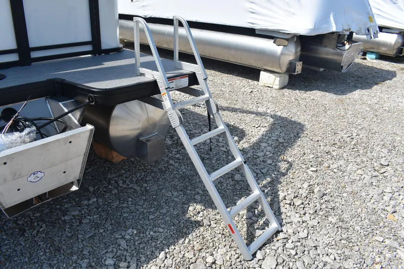 Slide: The Image of Aluminum ladder on 2026 Godfrey SWEETWATER SW 2086 C pontoon boat, gravel ground. - 6