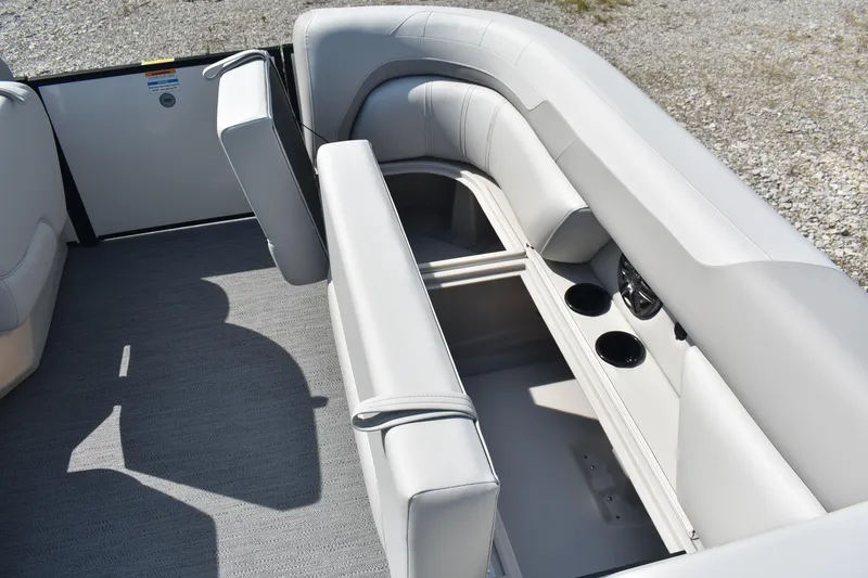Slide: The Image of 2026 Godfrey SWEETWATER SW 2086 C boat interior with gray seating and cup holders. - 8