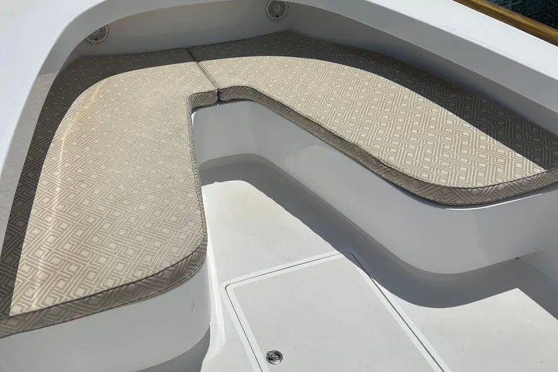 Slide: The Image of 2018 Jarrett Bay Center Console boat with patterned cushioned seating. - 5
