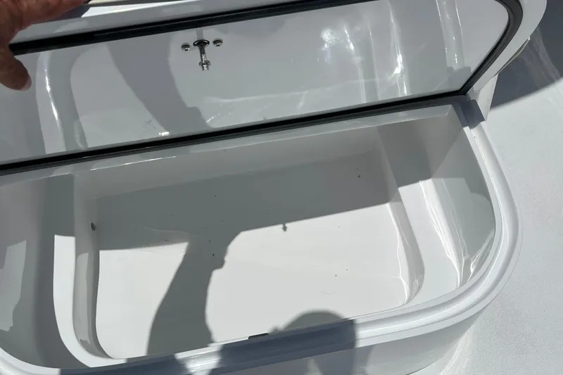 Slide: The Image of Open storage compartment on a 2018 Jarrett Bay Center Console boat. - 8