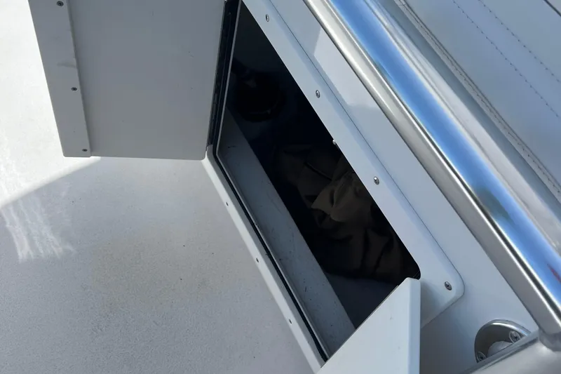 Slide: The Image of Open storage compartment on 2018 Jarrett Bay Center Console boat. - 9
