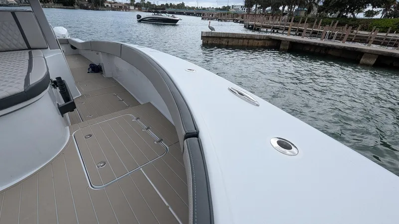 Slide: The Image of 2021 Vela 368 Center Console boat on calm waters near a dock. - 10