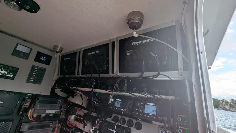 Slide: The Image of Interior of 2021 Vela 368 Center Console with Raymarine electronics and control panels. - 13