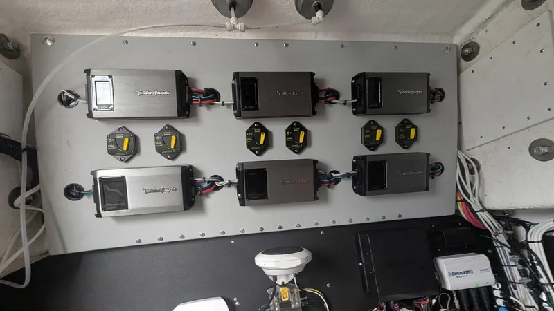 Slide: The Image of Electrical panel in a 2021 Vela 368 Center Console boat with multiple components. - 17