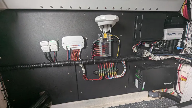 Slide: The Image of Electrical panel of 2021 Vela 368 Center Console boat with wiring and components. - 18