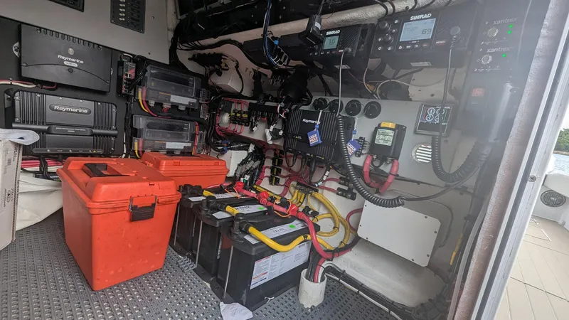 Slide: The Image of Interior of 2021 Vela 368 Center Console showing electrical equipment and wiring. - 19