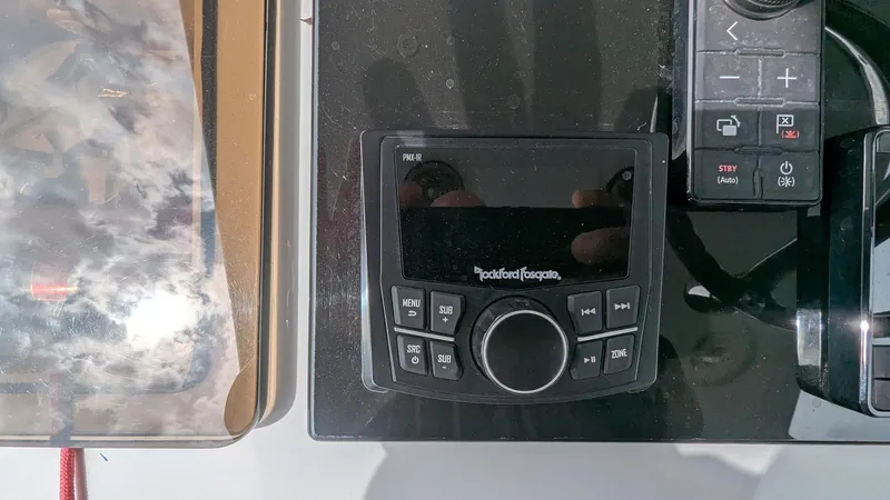 Slide: The Image of Control panel on a 2021 Vela 368 Center Console boat. - 22