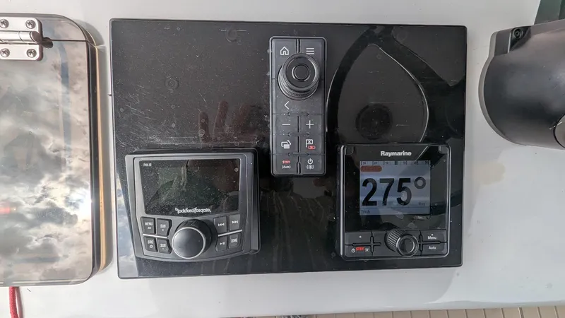 Slide: The Image of Control panel of a 2021 Vela 368 Center Console boat with navigation instruments. - 24