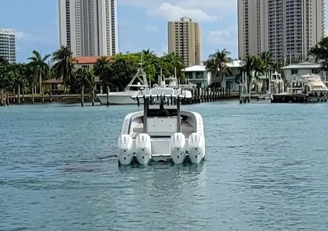 Slide: The Image of 2021 Vela 368 Center Console boat on water with city skyline background. - 34
