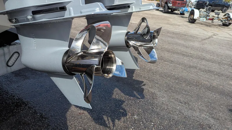 Slide: The Image of Twin stainless steel propellers on a 2021 Vela 368 Center Console boat. - 36