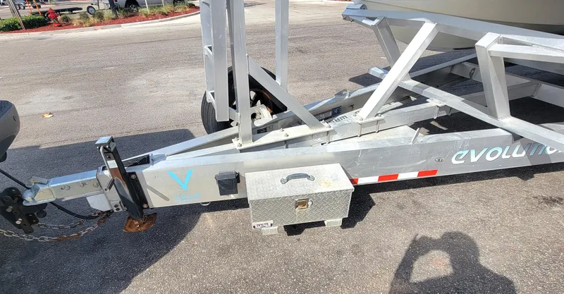 Slide: The Image of 2021 Vela 368 Center Console boat trailer hitch and frame on pavement. - 39