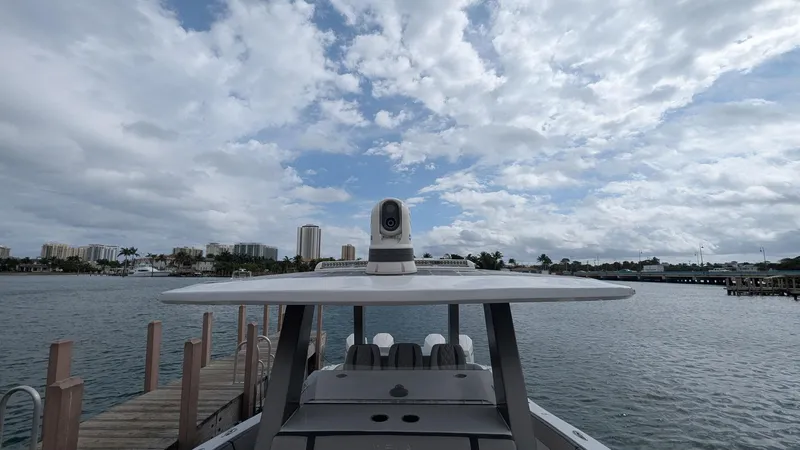 Slide: The Image of 2021 Vela 368 Center Console boat docked under cloudy sky. - 9