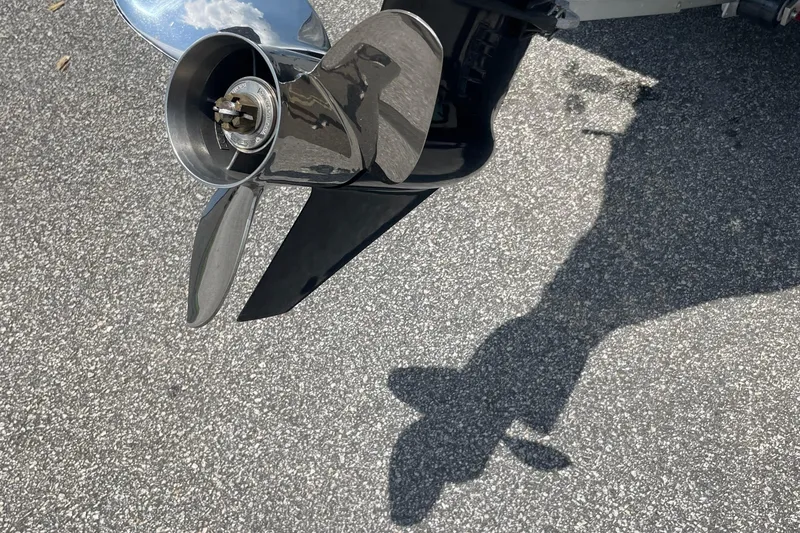 Slide: The Image of Close-up of Express H22 2023 boat propeller on asphalt surface. - 7