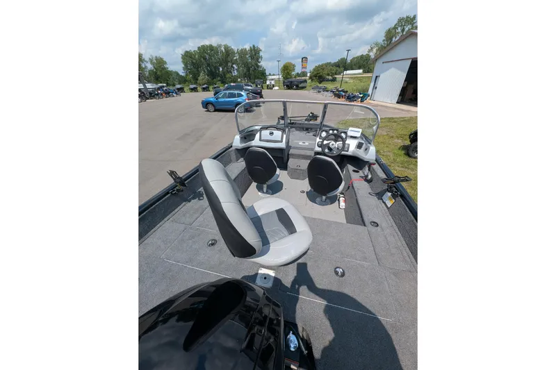 Slide: The Image of 2019 Tracker Pro Guide V-175 Combo boat interior with seating and dashboard view. - 5