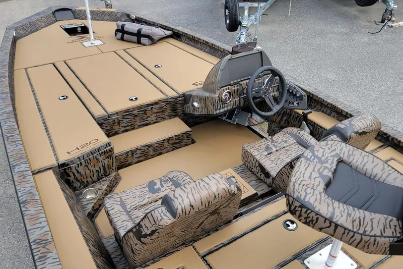 Slide: The Image of 2026 Xpress H20 Bass boat interior with Yamaha Vmax 175 SHO, camo design, steering console. - 5