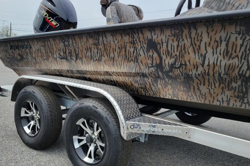 Slide: The Image of 2026 Xpress H20 Bass boat with Yamaha Vmax 175 SHO, camo design, on trailer. - 7