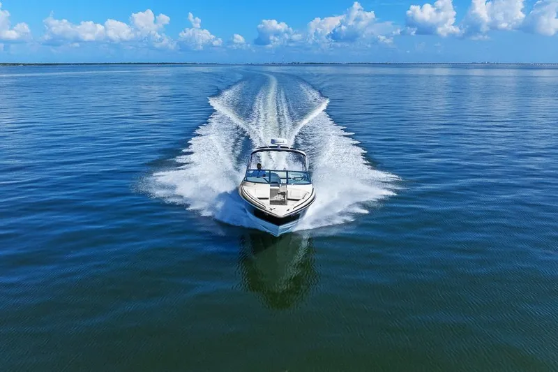 Slide: The Image of 2007 Formula 280 Bowrider speeding across open water under a clear blue sky. - 1