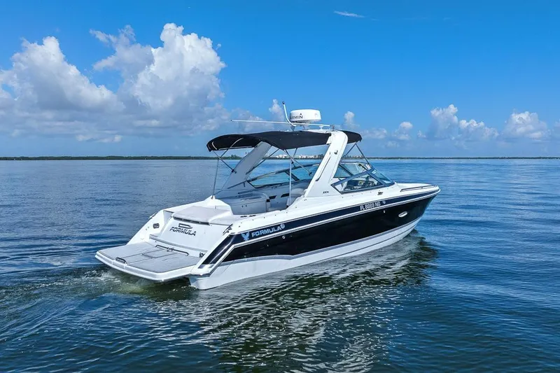 Slide: The Image of 2007 Formula 280 Bowrider cruising on calm blue waters under a clear sky. - 12