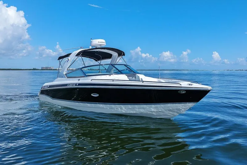 Slide: The Image of 2007 Formula 280 Bowrider boat cruising on calm blue waters under clear skies. - 13