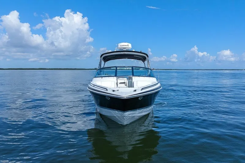 Slide: The Image of 2007 Formula 280 Bowrider on calm water under a clear blue sky. - 14