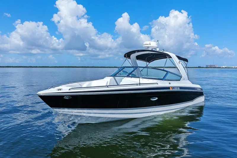 Slide: The Image of 2007 Formula 280 Bowrider boat cruising on calm water under a blue sky. - 15
