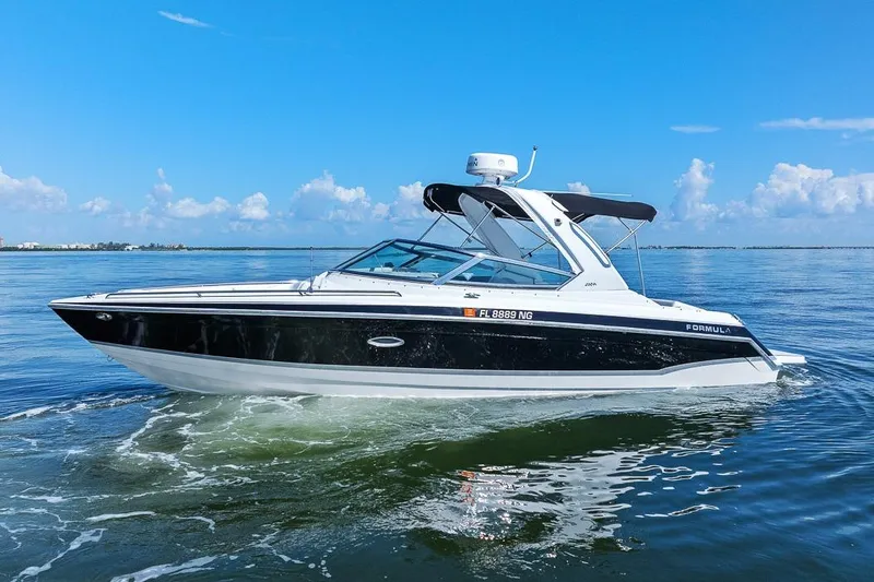 Slide: The Image of 2007 Formula 280 Bowrider cruising on calm waters under a clear blue sky. - 16