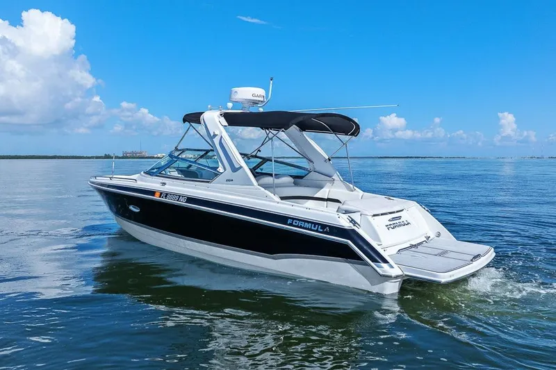 Slide: The Image of 2007 Formula 280 Bowrider boat cruising on calm blue waters under a clear sky. - 17