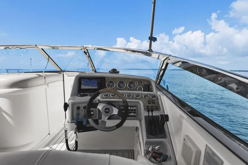 Slide: The Image of 2007 Formula 280 Bowrider helm with ocean view, featuring modern controls and gauges. - 2