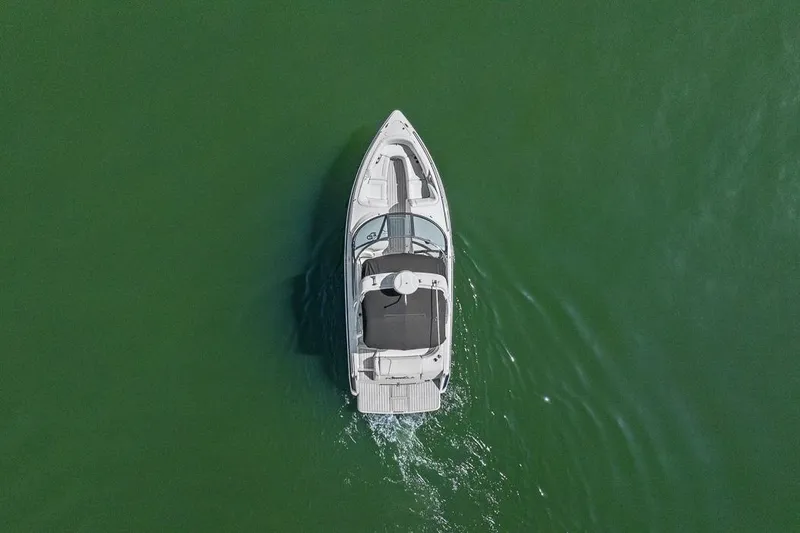Slide: The Image of Aerial view of 2007 Formula 280 Bowrider boat cruising on green water. - 21