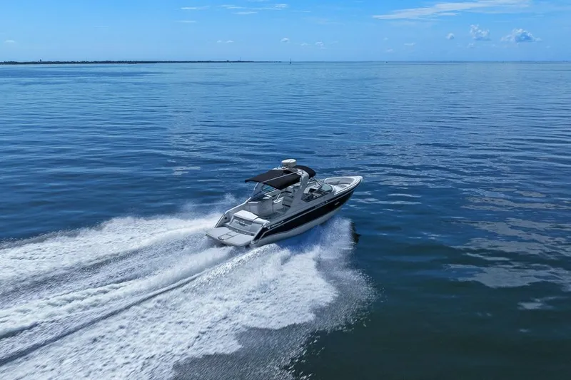 Slide: The Image of 2007 Formula 280 Bowrider cruising on open water under clear blue skies. - 23