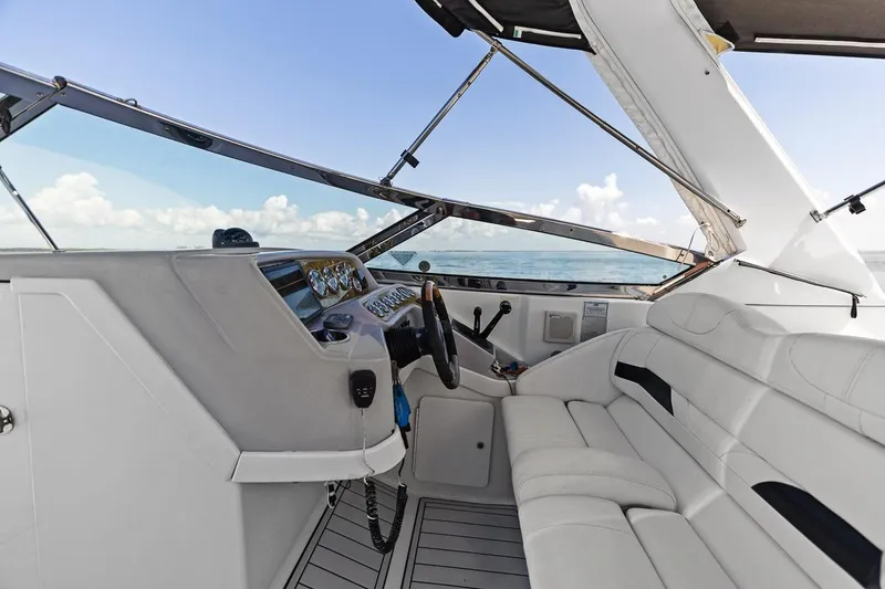 Slide: The Image of 2007 Formula 280 Bowrider interior with white seating and control panel, ocean view. - 26