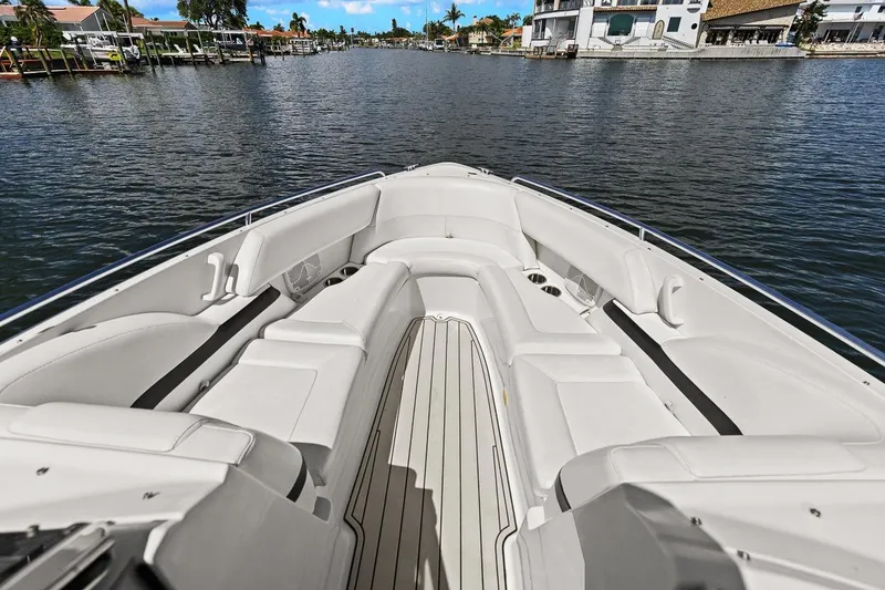 Slide: The Image of 2007 Formula 280 Bowrider boat interior with spacious seating on a scenic waterway. - 33