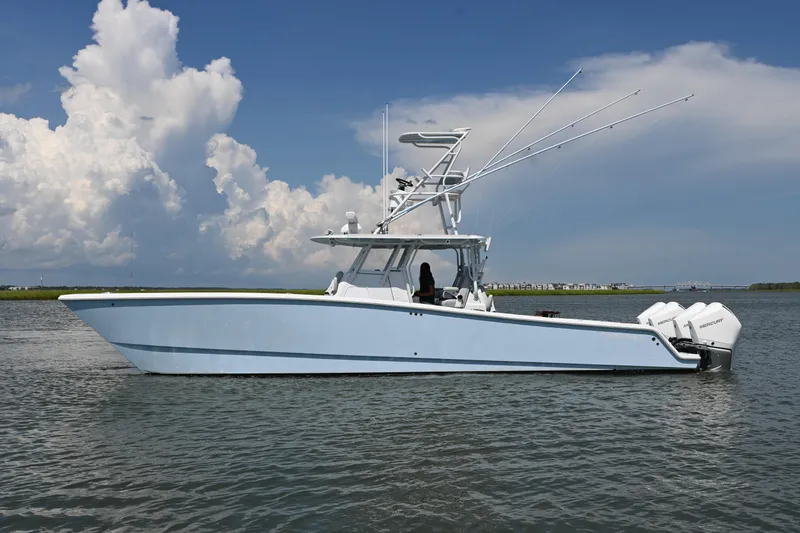 The Image of 2021 Freeman 37VH boat on water, clear sky, powerful engines, sleek design. - 0