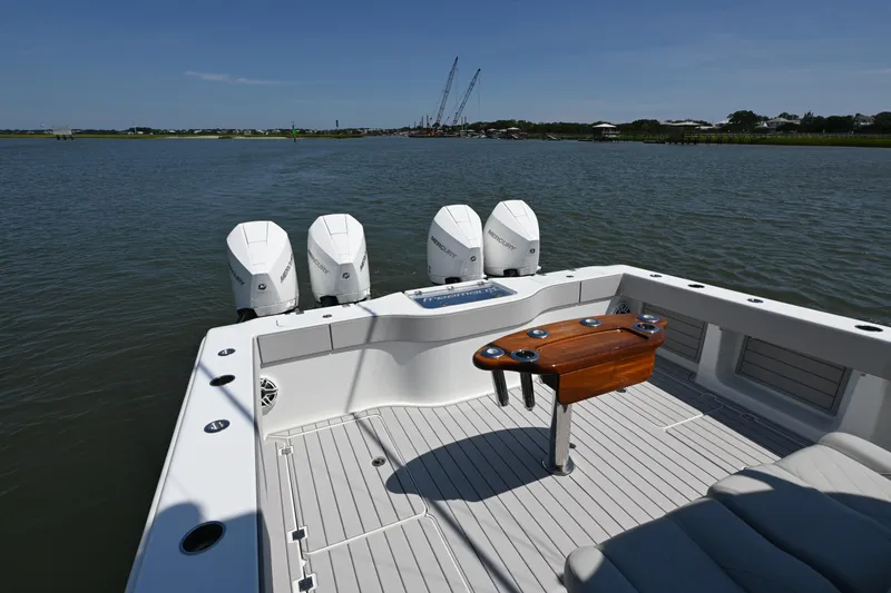 Slide: The Image of Freeman 37VH 2021 boat with four Mercury engines on a calm waterway. - 15