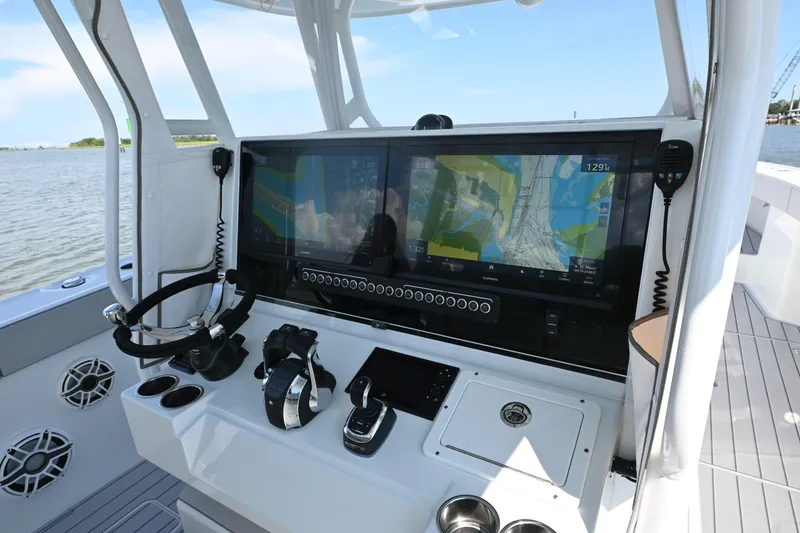 Slide: The Image of Freeman 37VH 2021 boat dashboard with navigation screens and controls. - 18