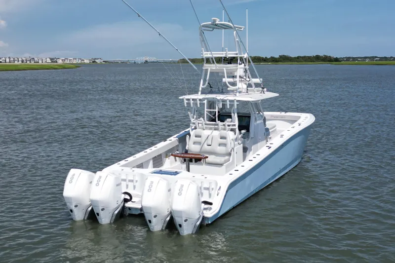 Slide: The Image of 2021 Freeman 37VH boat with quad engines on calm water. - 2