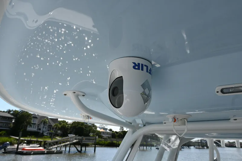 Slide: The Image of FLIR camera mounted on a Freeman 37VH boat, 2021 model, with waterfront view. - 21