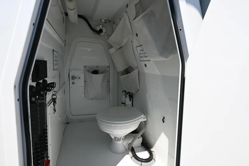 Slide: The Image of Interior of a 2021 Freeman 37VH boat bathroom with toilet and storage compartments. - 22