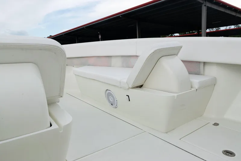 Slide: The Image of 2017 SeaVee 340Z boat interior with white cushioned seating and speaker. - 13