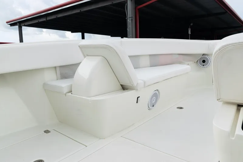 Slide: The Image of 2017 SeaVee 340Z boat interior with white seating and built-in speakers. - 15