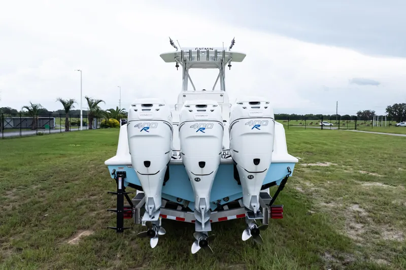 Slide: The Image of 2017 SeaVee 340Z boat with triple 400R engines on grassy field. - 2