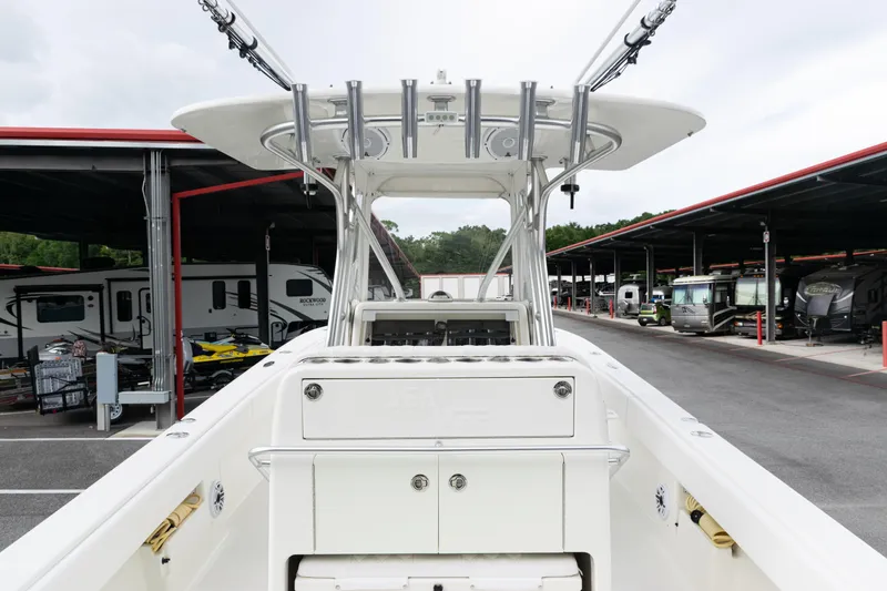 Slide: The Image of 2017 SeaVee 340Z boat docked in a storage facility with RVs in the background. - 21