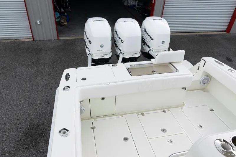 Slide: The Image of 2017 SeaVee 340Z boat with triple outboard engines in storage facility. - 28