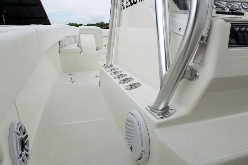 Slide: The Image of 2017 SeaVee 340Z boat interior with white seating and stainless steel railings. - 29
